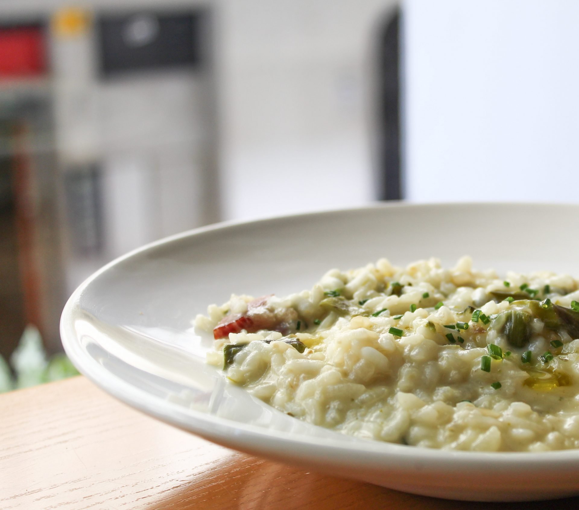 Arroz meloso con jamón ibérico, espinacas, espárragos y parmesano.